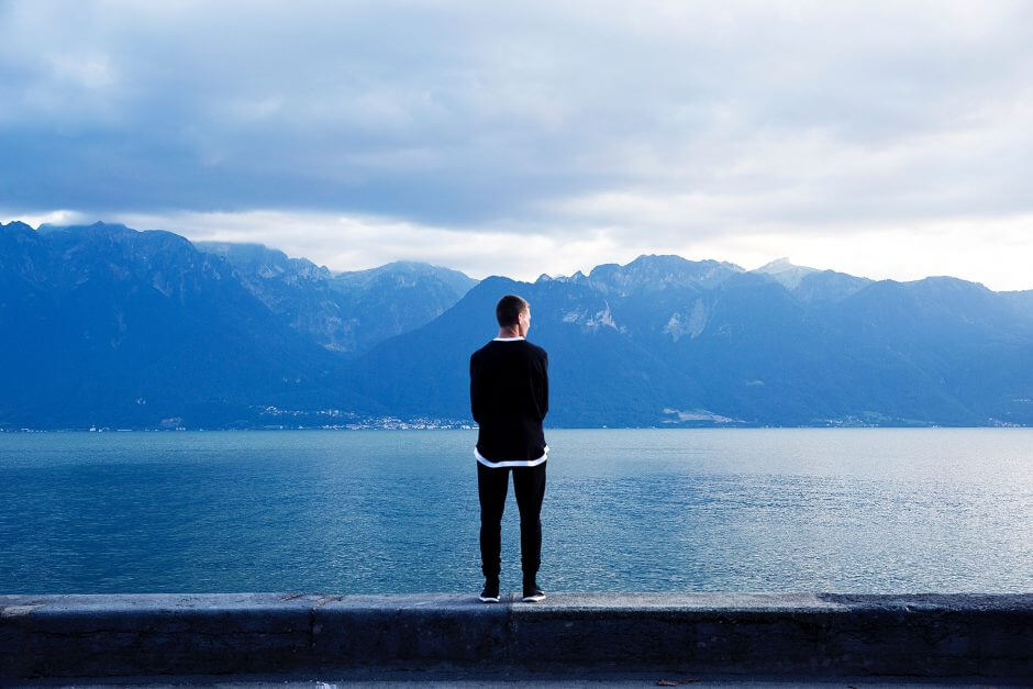 man facing mountains struggling with girlfriend's past