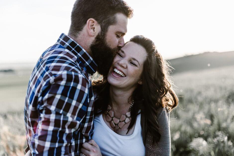 man kissing wife